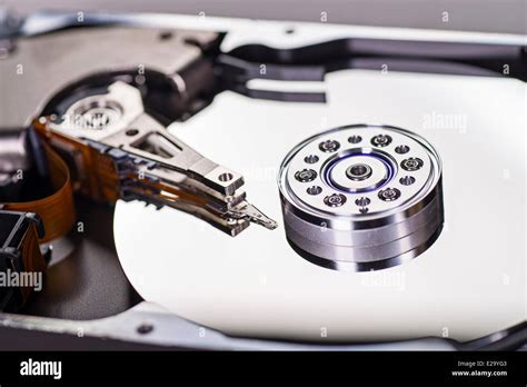 Detail of a opened hard disk with write and read head and disk Stock Photo - Alamy