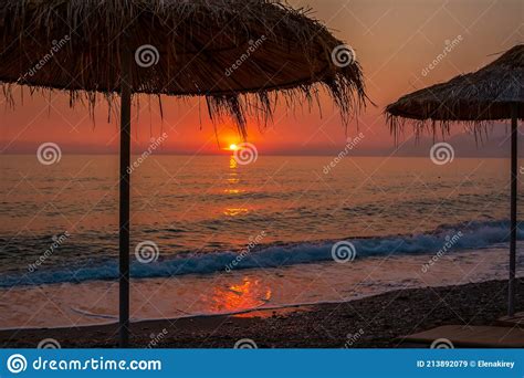 Beach with Shade Umbrella on Sunset Stock Image - Image of peak, pink: 213892079