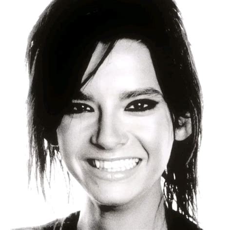 a black and white photo of a smiling woman