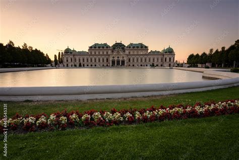 Famous Belvedere castle (Schloss Belvedere) surrounded by flowering gardens and a lake, Vienna ...