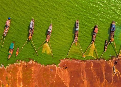 Premium Photo | Aerial view of fishing boat moored at harbor