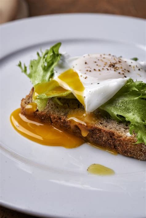 Egg benedict on a toast stock photo. Image of breakfast - 189959772