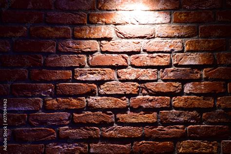 Spotlight above the Brick wall. Brick wall texture. Red brick wallpaper. Background Red Brick ...