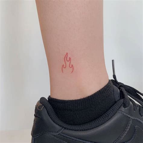 Minimalist fire tattoo in red ink