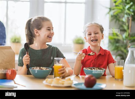 Group Of Kids Eating Cereal