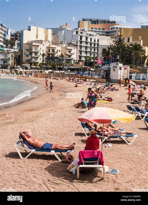 The beach at St George's Bay, Malta Stock Photo - Alamy