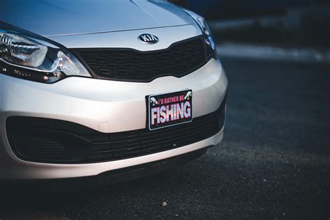 White Kia Rio Car on Road · Free Stock Photo