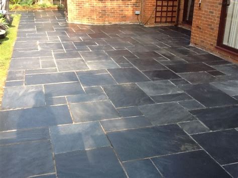 Tile Doctor - Showing The Results of Cleaning Slate on a Client's Patio - West Surrey Tile Doctor