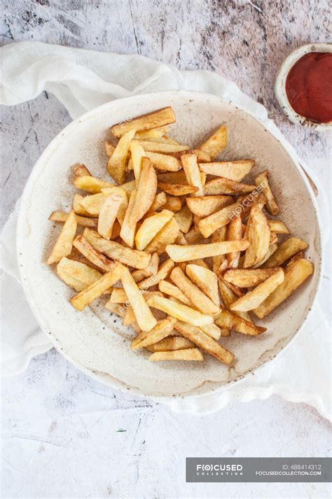 Homemade french fries served with ketchup — frying, deep fry - Stock Photo | #488414312