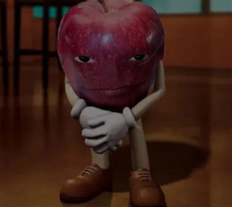 an apple sitting on top of a wooden floor