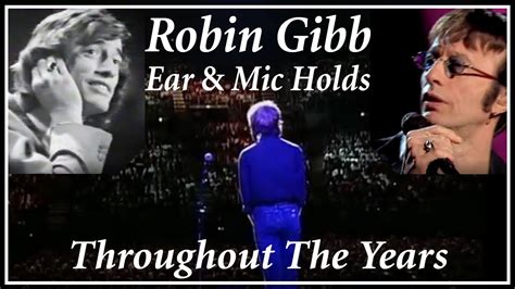 What is Robin Gibb holding up to his ear? – Fabalabse