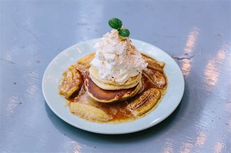 Premium Photo | Pancakes with caramel-banana syrup.