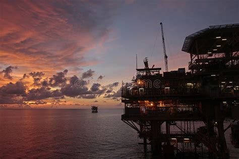 Offshore oil rig at sunset editorial photo. Image of barton - 261280806