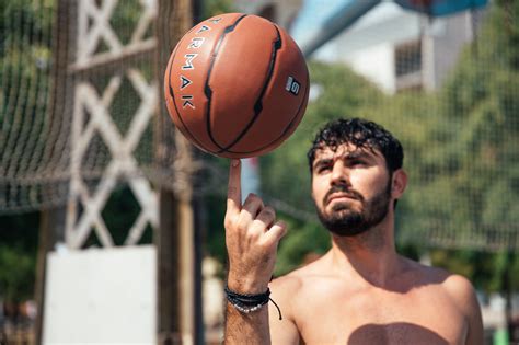 Free Stock Photo of Man Spinning Basketball On Finger — HD Images