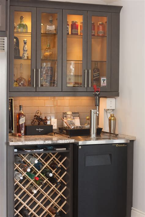 Custom wine rack in bar area with Kegerator and glass door liquor cabinets. | Home bar cabinet ...