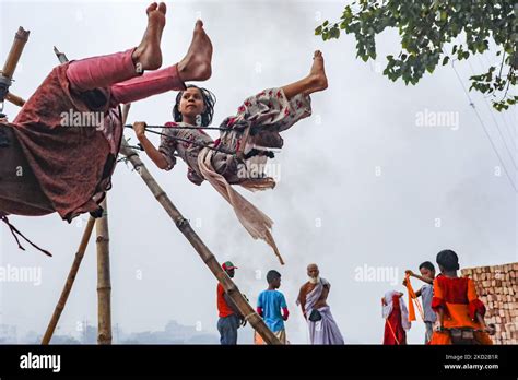 Children in Dhaka's slums play. Often these children are frequently stunted and malnourished and ...