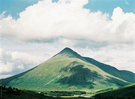 "Picturesque Landscape With Triangle Mountain" by Stocksy Contributor "Javier Díez" - Stocksy