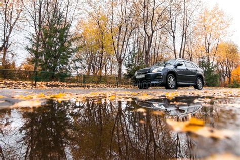 Black SUV on Autumn Road in Rainy Day Stock Image - Image of vehicle ...