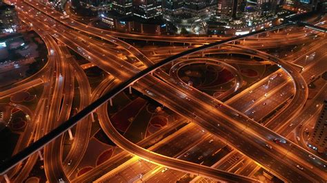 Aerial view of highway and overpass in city at night timelapse 33198049 Stock Video at Vecteezy