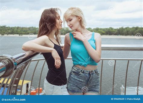 Woman Flirting with a Friend. Stock Image - Image of lovers, homosexual: 99609659