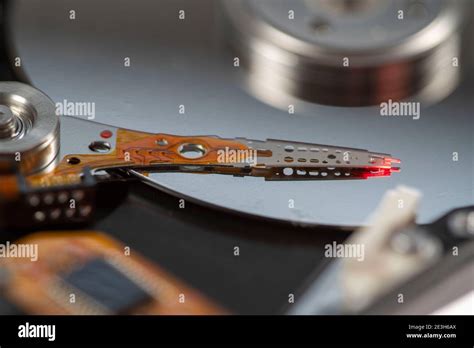 Computer hard disk, opened, read-write head on the storage disk. Symbol image Stock Photo - Alamy