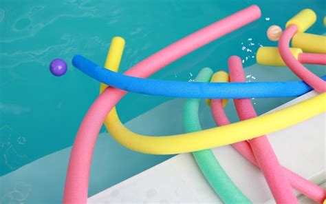 Premium Photo | Water aerobic equipment. colored aqua noodles in swimming pool