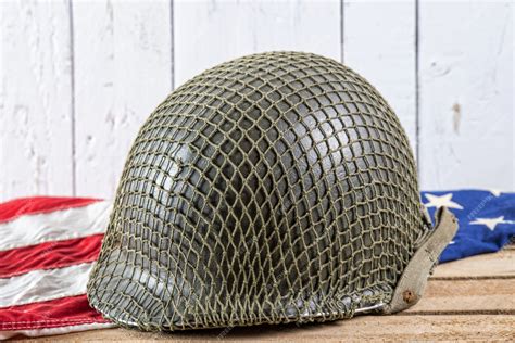 Premium Photo | Military helmet on an american flag