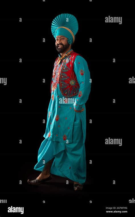 A Bhangra Dancer performing a dance step with hand gestures Stock Photo - Alamy