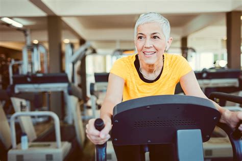 Mature Woman Exercising In Gym. - Hillsboro Eye Clinic, P.C.