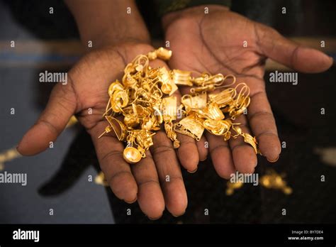 Somali woman trader holds gold jewelery at Hargeysa market, Somaliland, Somalia, Africa Stock ...