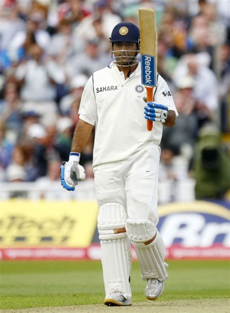 MS Dhoni raises his bat after getting to his half-century | ESPNcricinfo.com