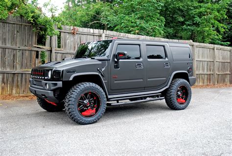 Hummer H2 wrapped with a satin black wrap outfitted on some 22" Fuel ...