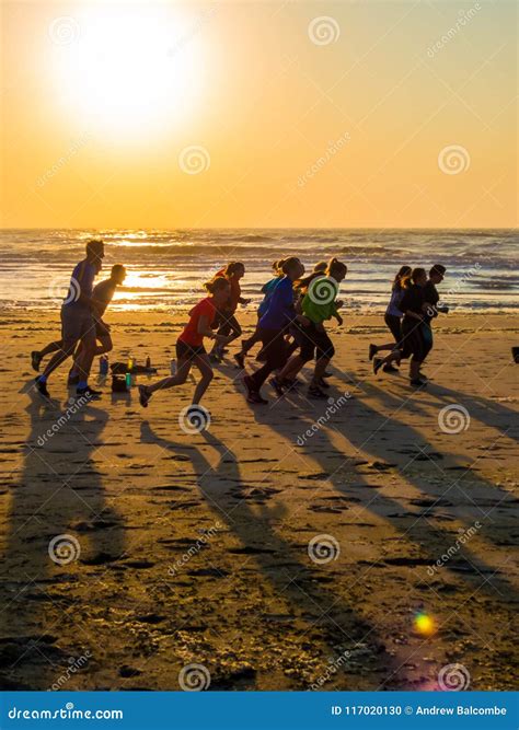 Sunset Running on the Beach Editorial Image - Image of beach, beautiful ...