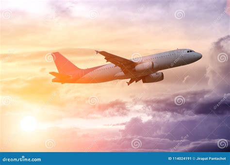 Silhouette of a Plane Flying in Beautiful Sunset Stock Image - Image of sunlight, cloud: 114024191