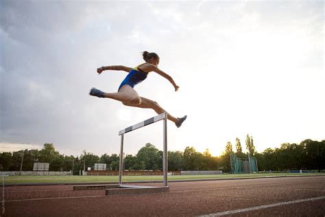 "Young Female Hurdler Training At Dusk." by Stocksy Contributor "Hugh ...