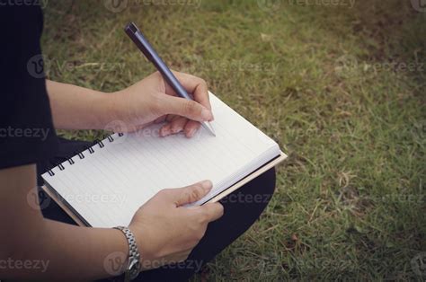 Person writing in a journal 1976183 Stock Photo at Vecteezy