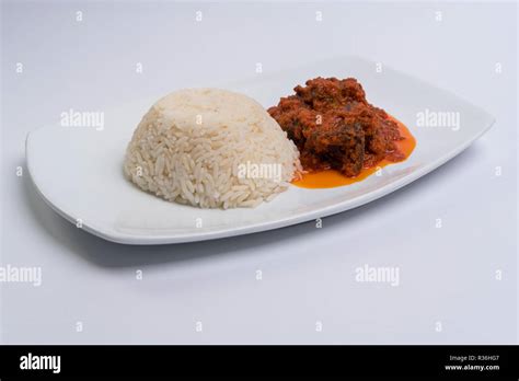 White rice and stew Stock Photo - Alamy