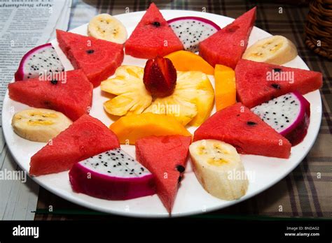 Tropical fruit salad watermelon pineapple banana dragon fruit and mango Stock Photo - Alamy