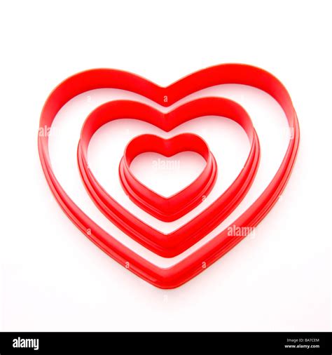 Three different sized heart shaped objects Stock Photo - Alamy