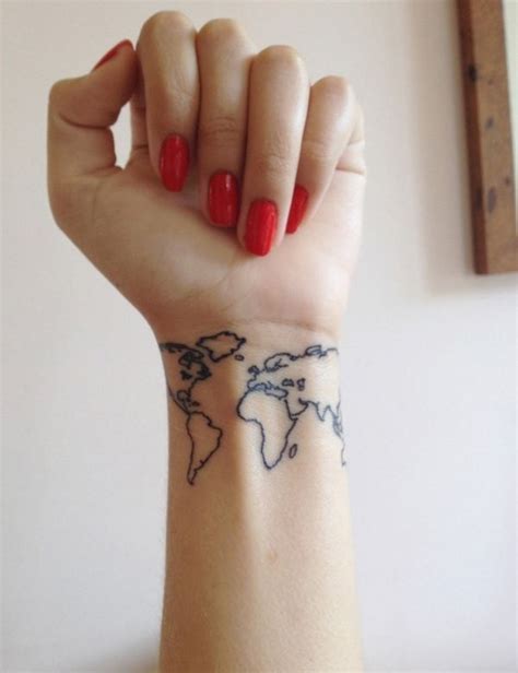 Small size dark black ink world map contour tattoo on wrist - Tattooimages.biz