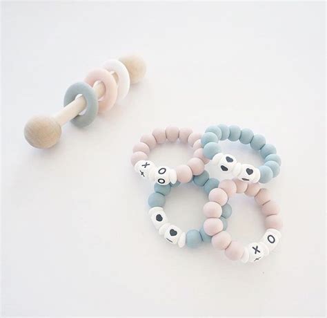 Baby Teething Toys And Rattles | Handmade baby gifts, Wooden baby teether, Newborn gift sets