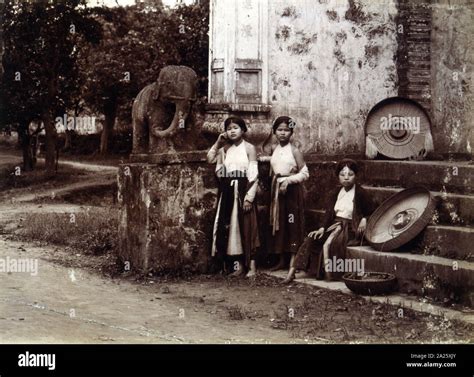 French colonial workers resting near a temple; Vietnam; Photograph; 1895 Stock Photo - Alamy