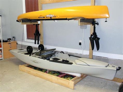 kayak holders for garage lookng kyk rck tht locted n grge kayak garage storage lift kayak ...