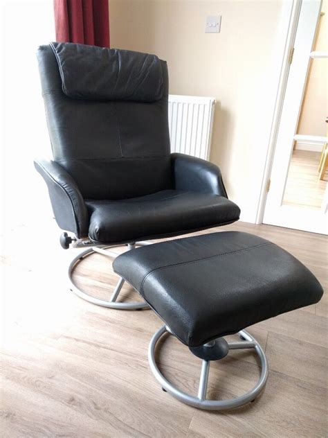 Ikea Malung black leather swivel & recliner chair with matching footstool | in Ely ...