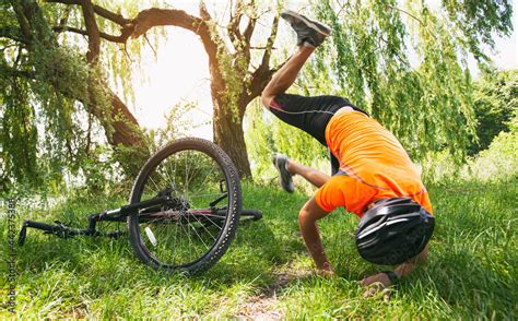 Man falling from the bike on the pathway in the countryside Stock Photo ...