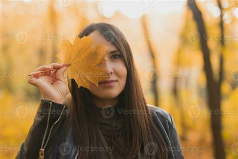 Portrait of autumn woman with fall leaf on nature background. Seasonal concept. 26223837 Stock ...