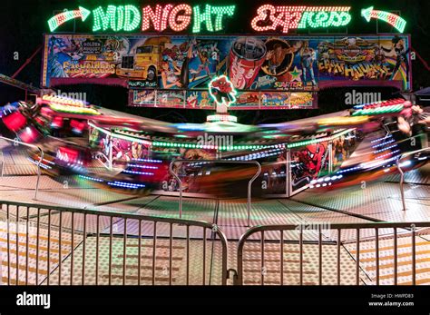 A colourful carnival ride, Midnight Express, going at high speed at ...