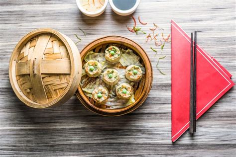 Vegetable Sui Mai with Sauce and Chopsticks Isolated on Wooden Board Top View on Table Fastfood ...