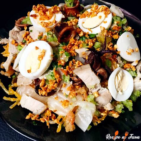 Pancit Malabon Recipe with eggs, squid and shrimp