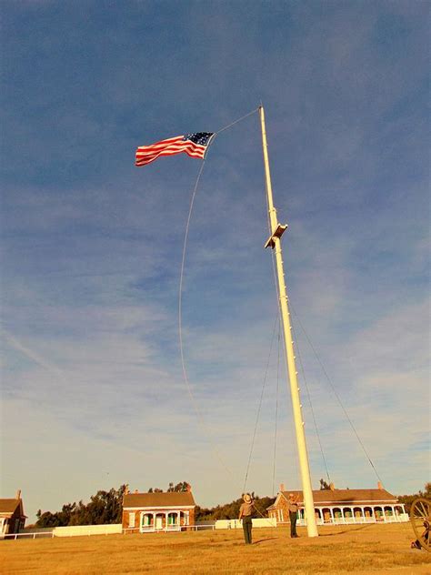 Hoisting The Flag Photograph by Carl Miller - Fine Art America